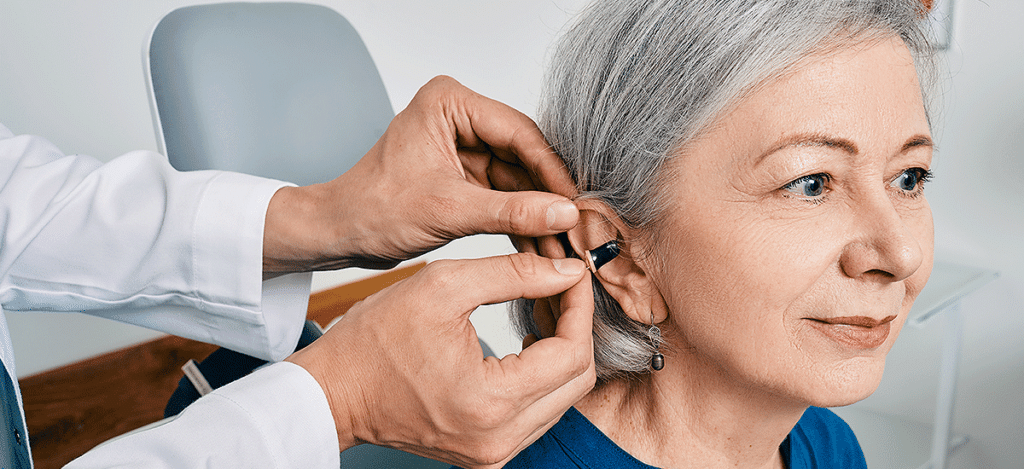 Woman getting fitted with hearing aids
